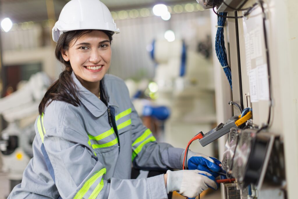 electricity engineer female working check service high voltage electrical cabinet